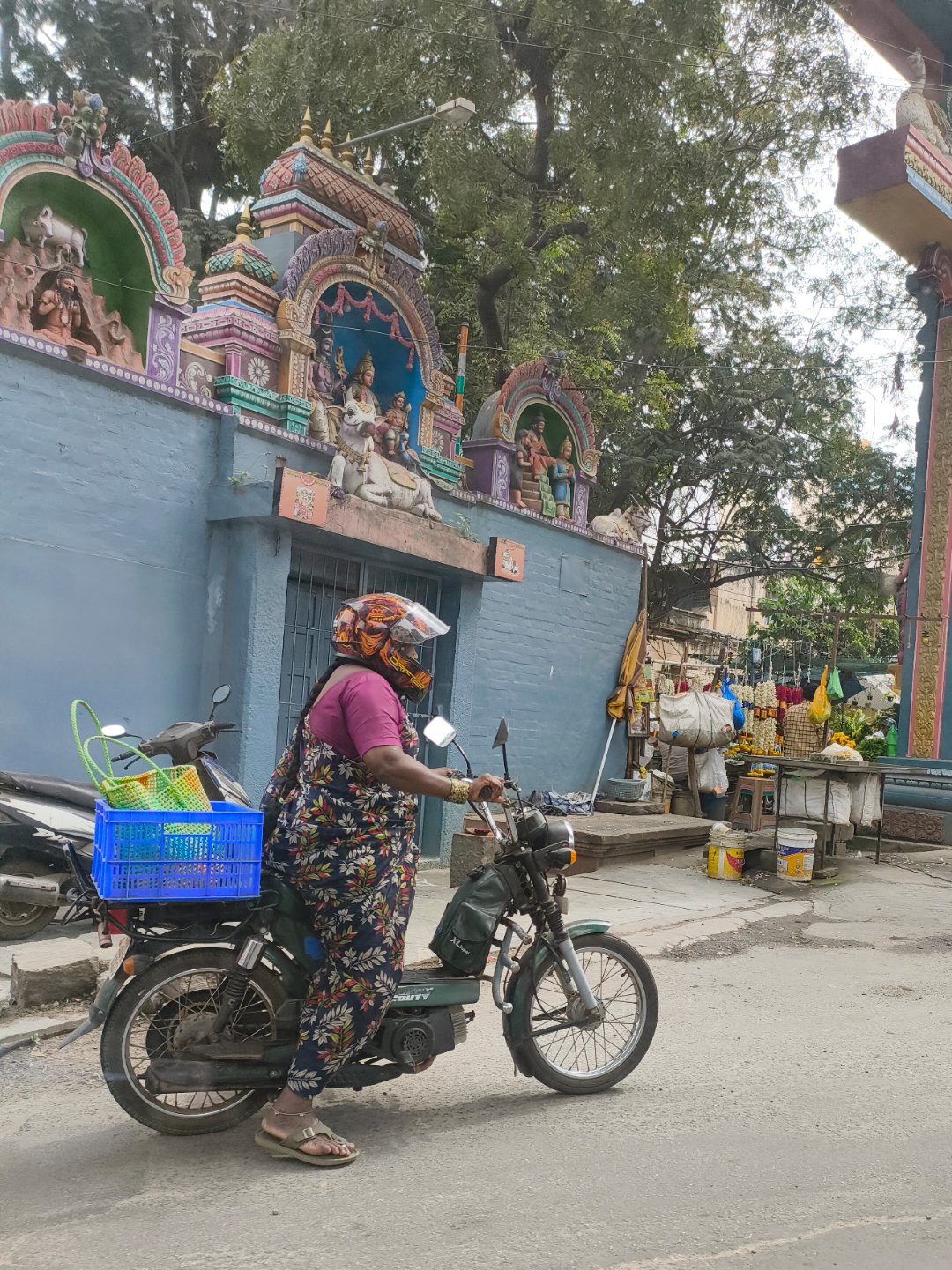 Kamala with her scooter in the Jayanagar market