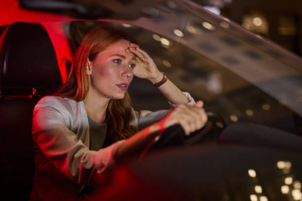 Priya stressed in her car at night
